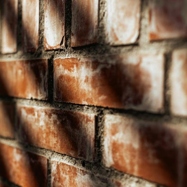 Soft light hitting a dark wall creating shadows